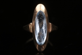 Golden ring with topaz