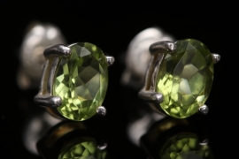 Small silver ear studs with peridot