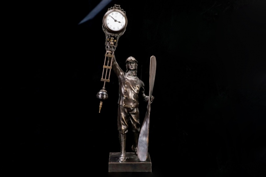 Junghans - Bronze figure of a pilot & pendulum shaped clock 20s/30s